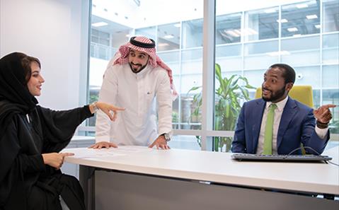 Three SABIC employees talking