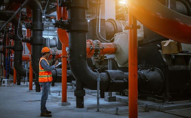 Engineer under checking the industry cooling tower